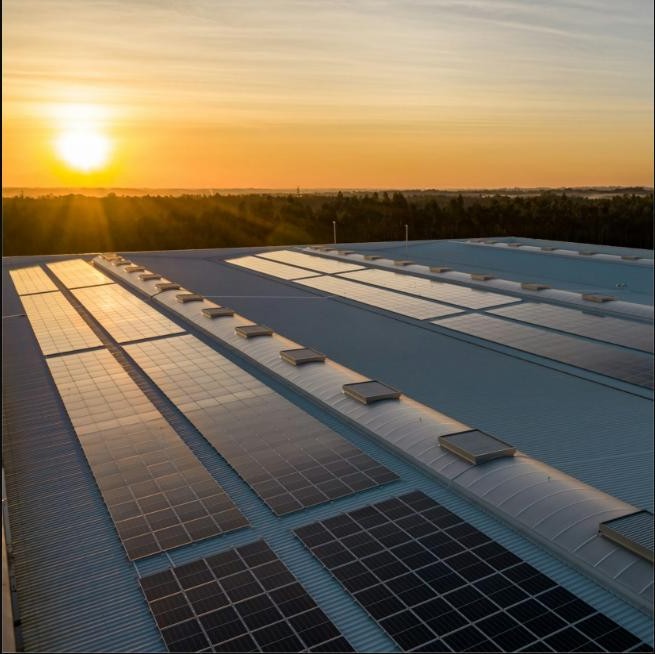 Rooftop solar installation at sunset